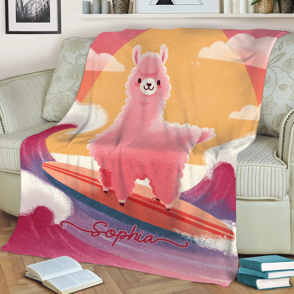 Colorful llama surfing artwork displayed on a sofa blanket with sunset and wave details