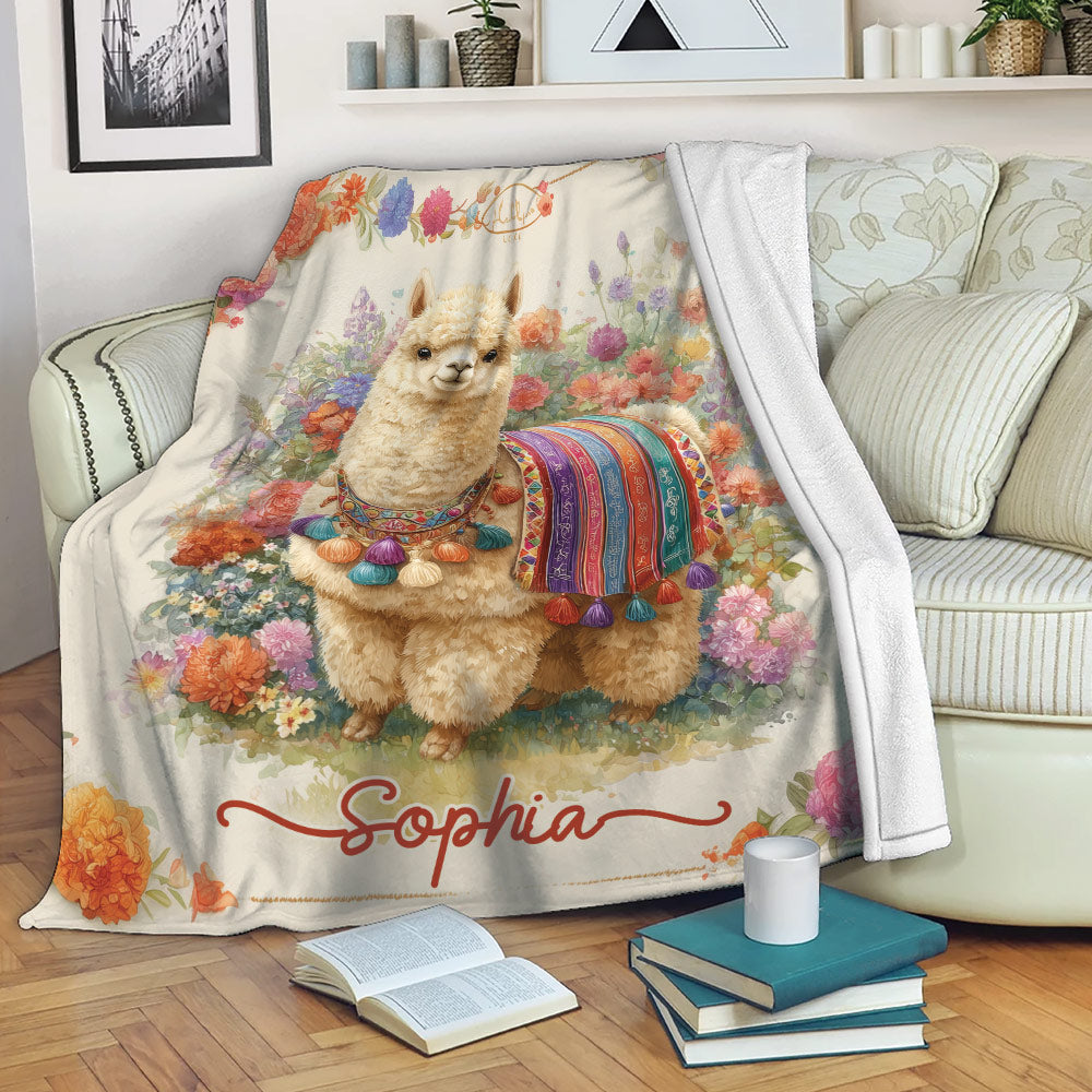 Floral llama throw blanket displayed across a sofa in a cozy living room