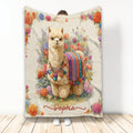 Llama blanket featuring a colorful floral scene and ornate woven-style textile artwork