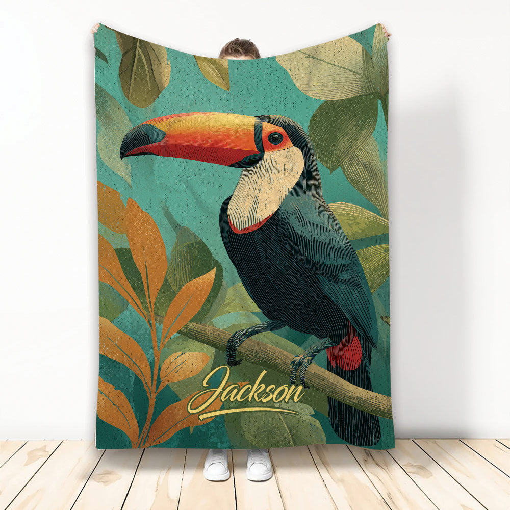 Toucan throw blanket with colorful tropical bird artwork and leafy botanical background
