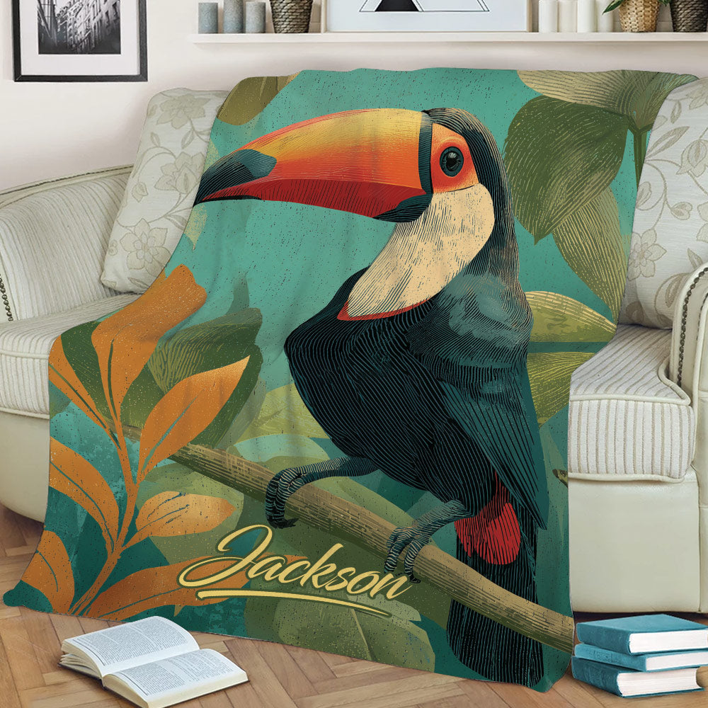 Close view of a colorful toucan blanket displayed on a sofa with botanical artwork