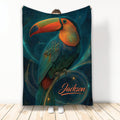Colorful toucan blanket featuring vibrant tropical bird artwork on a deep teal background