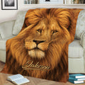 Close view of a lion throw blanket spread across a sofa with realistic golden mane artwork