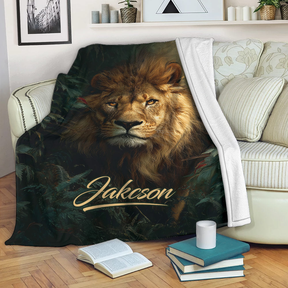 Lion blanket draped over a sofa, featuring dramatic wildlife artwork and forest foliage