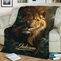 Close view of a lion throw blanket displayed on a sofa with rich jungle artwork