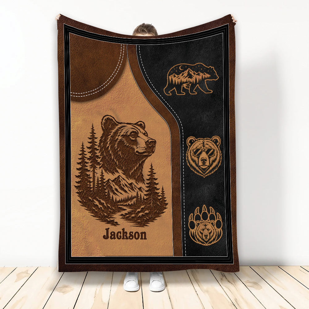 Rustic bear throw blanket with mountain, forest, paw print, and wildlife artwork in brown and black