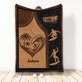Surfing throw blanket with vintage wave artwork, palm trees, and silhouetted surfers in a beach scene