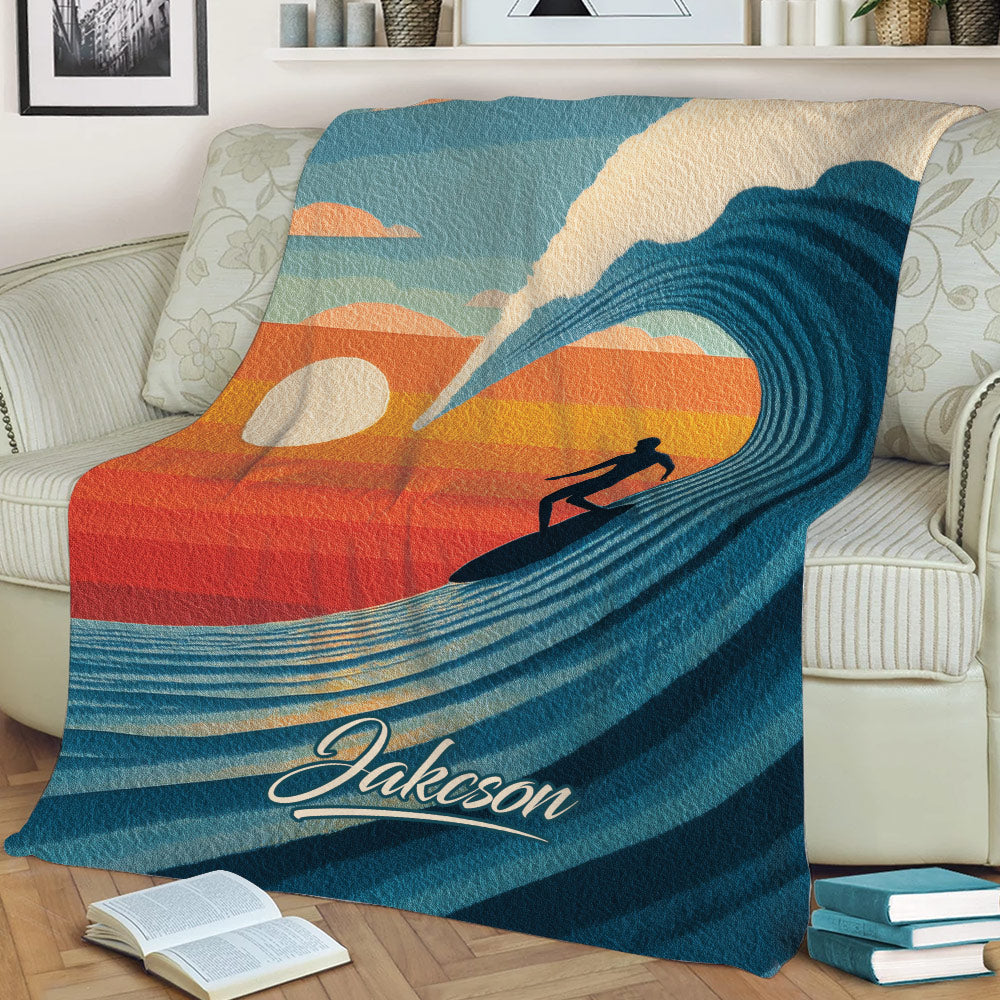 Retro surfing throw blanket displayed on a couch with colorful ocean wave artwork