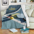 Pickleball throw blanket draped over a sofa with paddle and ball court design