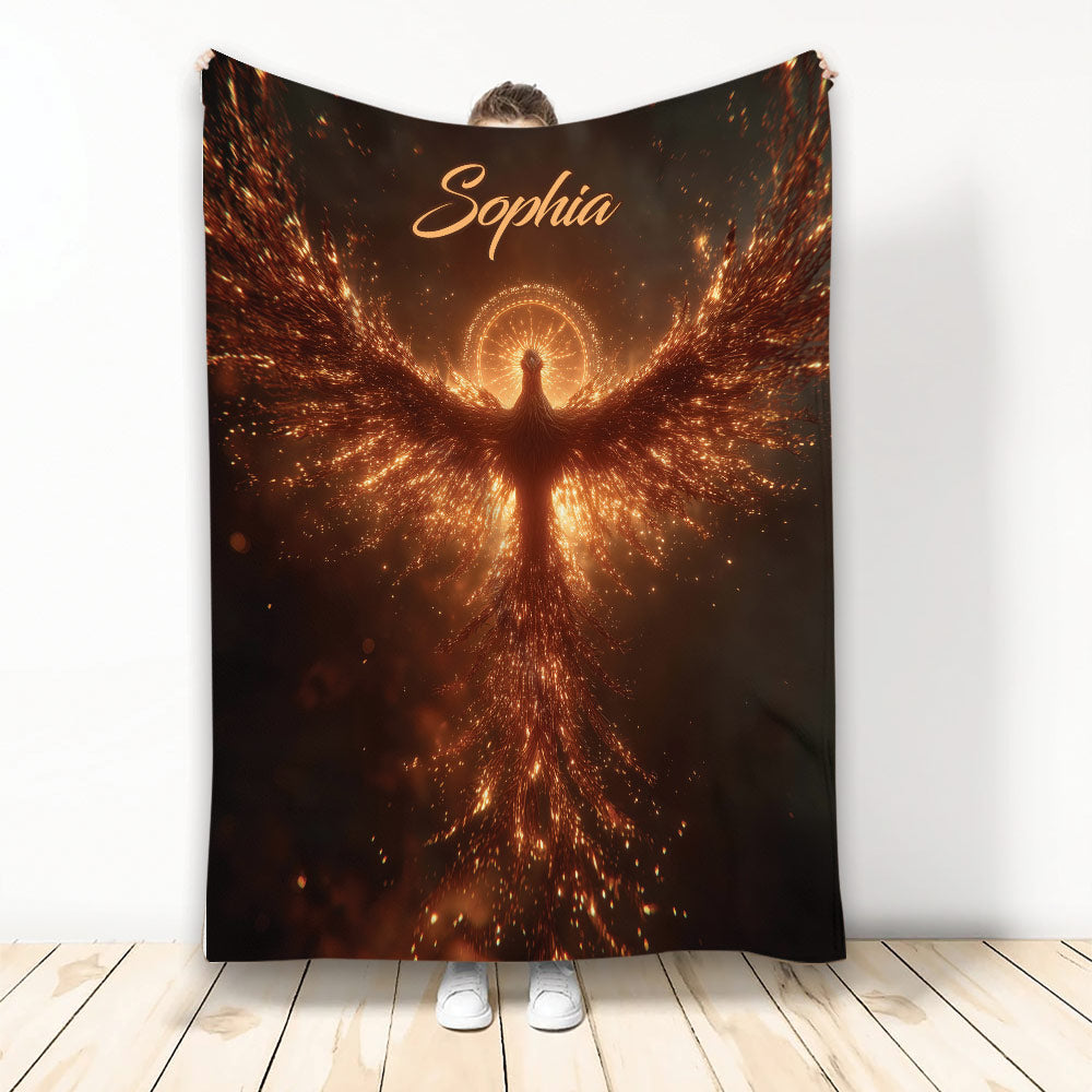 Phoenix throw blanket featuring a glowing fiery bird with radiant orange sparks and dramatic dark artwork