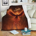 Fiery phoenix throw blanket draped over a sofa in a cozy living room setting