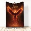 Fiery phoenix blanket displayed upright with glowing orange wings and ember-inspired artwork