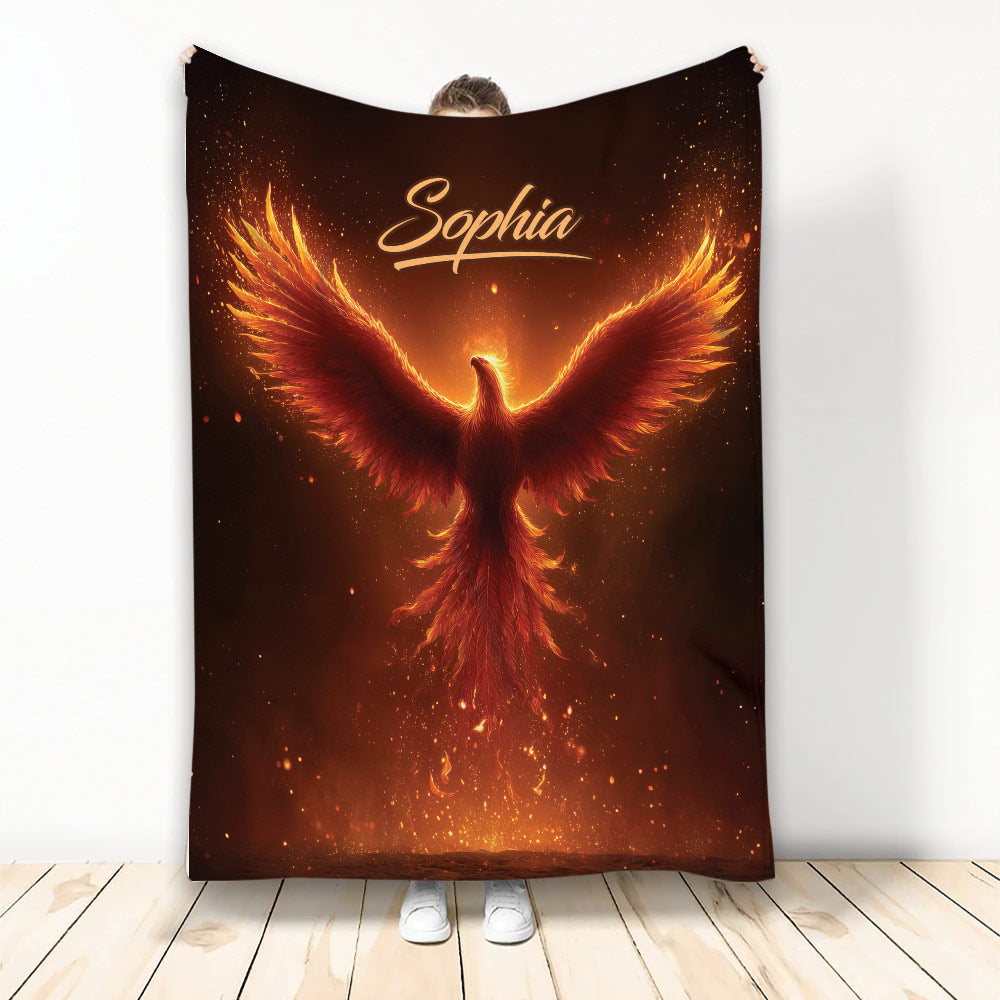 Fiery phoenix blanket displayed upright with glowing orange wings and ember-inspired artwork