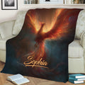 Phoenix blanket spread over a sofa with dramatic flames and deep blue background