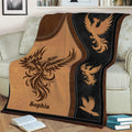 Close view of phoenix throw blanket featuring a large winged bird and smaller phoenix motifs