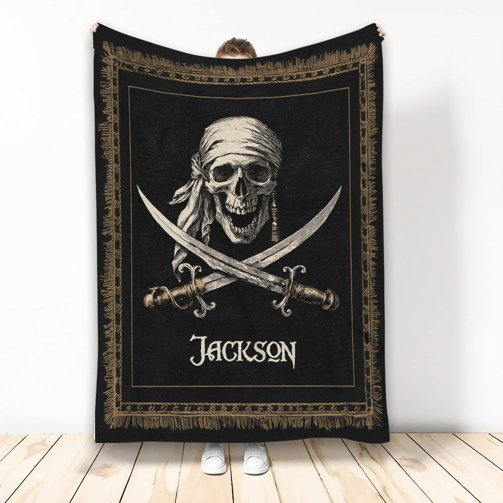 Black and gold pirate blanket featuring a skull in a bandana and crossed swords