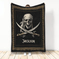Black and gold pirate blanket featuring a skull in a bandana and crossed swords