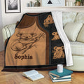 Koala throw blanket displayed on a sofa with cozy Australian wildlife illustrations