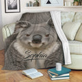 Koala throw blanket draped over a sofa in a cozy living room setting