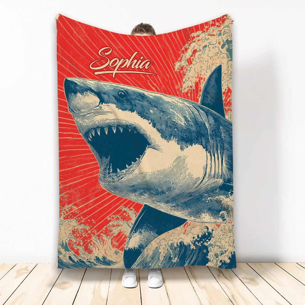 Shark throw blanket displayed upright with a vintage ocean wave illustration in red, cream, and navy