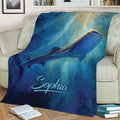 Shark throw blanket displayed on a sofa with vibrant whale shark and ocean scene artwork
