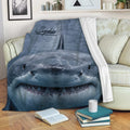 Realistic shark throw blanket draped across a sofa in a cozy living room