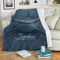 Hammerhead shark blanket draped over a sofa in a cozy living room setting