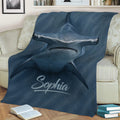 Close view of a hammerhead shark throw blanket styled across a sofa