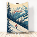 Skiing throw blanket with skier on a snowy mountain slope and evergreen forest artwork