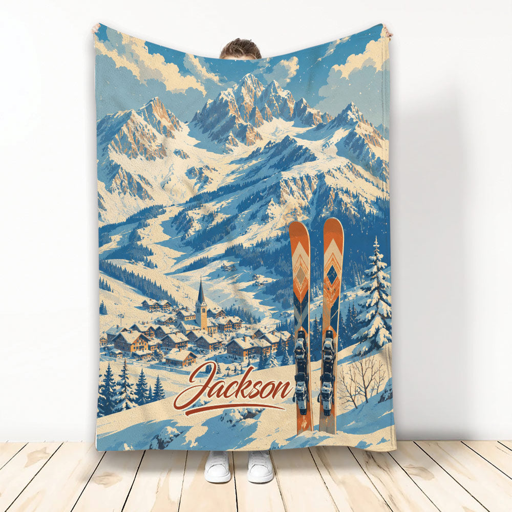 Skiing throw blanket featuring vintage snowy mountains, alpine village, and orange skis