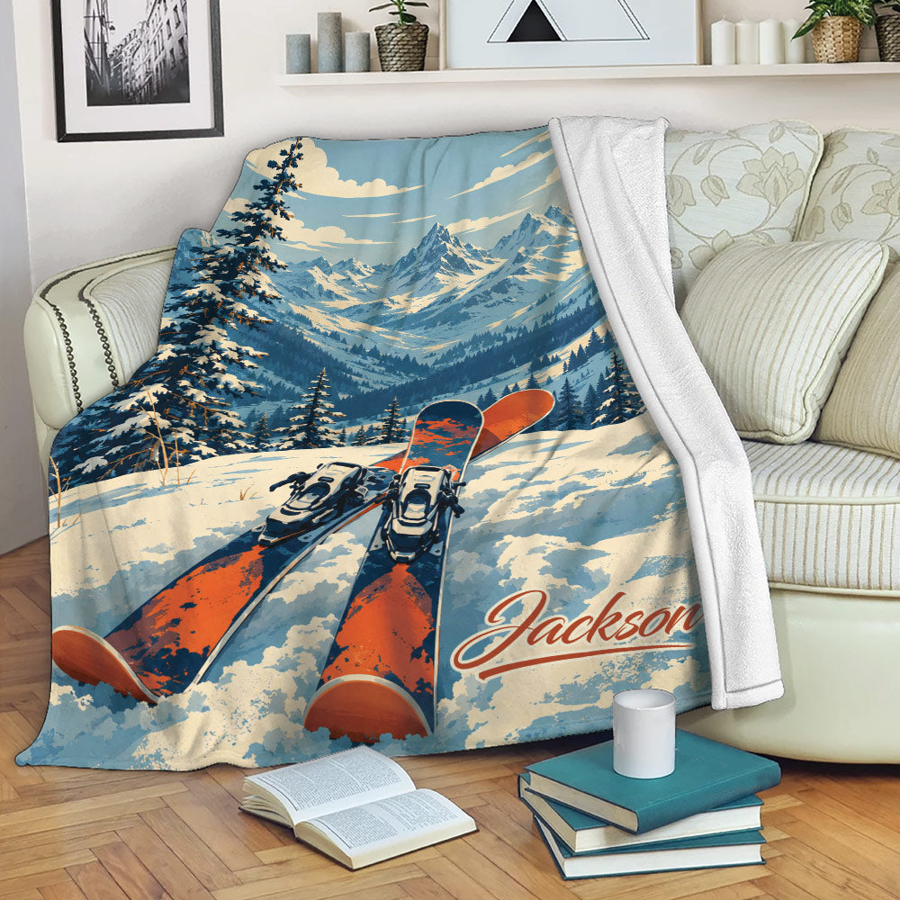 Skiing throw blanket displayed on a couch with colorful skis and mountain landscape artwork
