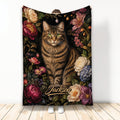 Tabby cat blanket with ornate floral artwork in rich jewel tones, shown hanging as a room accent