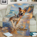 Close view of an American Staffordshire throw blanket draped over a sofa with watercolor beach artwork
