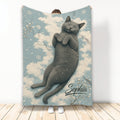 Russian Blue cat blanket with a sleepy cat artwork, blue sky, clouds, branches, and snowflakes