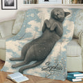 Russian Blue cat blanket draped over a sofa, featuring a relaxed cat among clouds and snowflakes