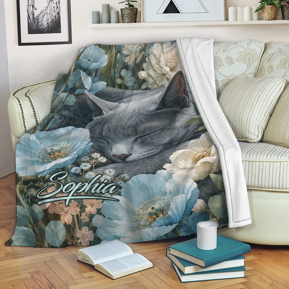 Russian Blue cat floral throw blanket styled on a sofa with books and a warm living room setting