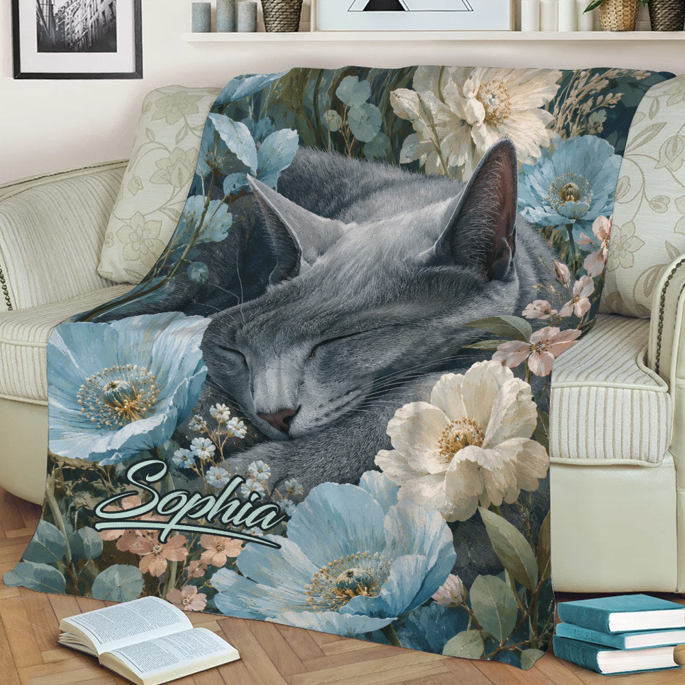 Russian Blue cat blanket draped across a sofa, featuring blue botanical flowers and soft neutral decor