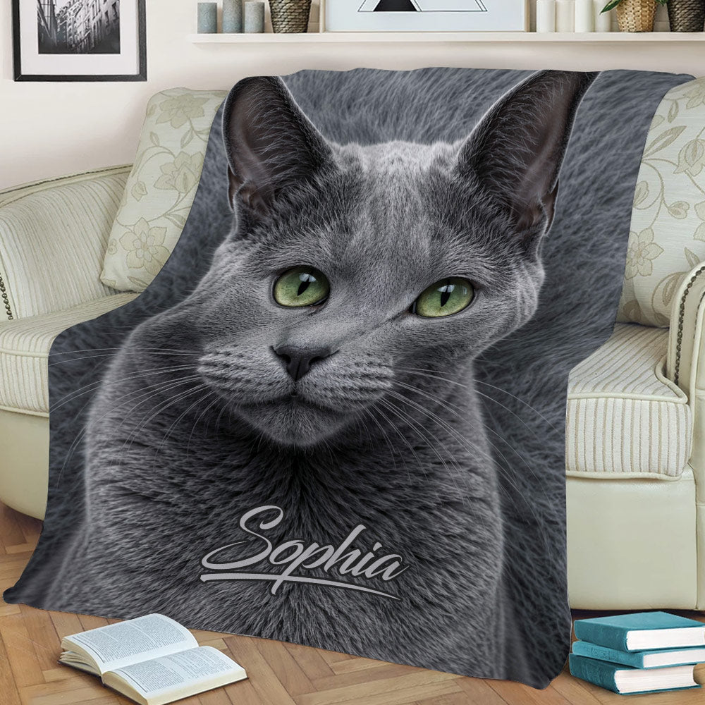Close view of a Russian Blue cat throw blanket with detailed gray fur and green eyes