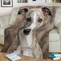 Close view of a brindle Whippet throw blanket styled across a sofa with realistic sighthound artwork