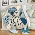 Dalmatian throw blanket draped over a sofa with spotted dog artwork in a cozy living room