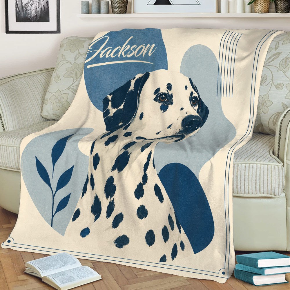 Spotted Dalmatian dog throw blanket displayed on a sofa with blue and cream decorative artwork