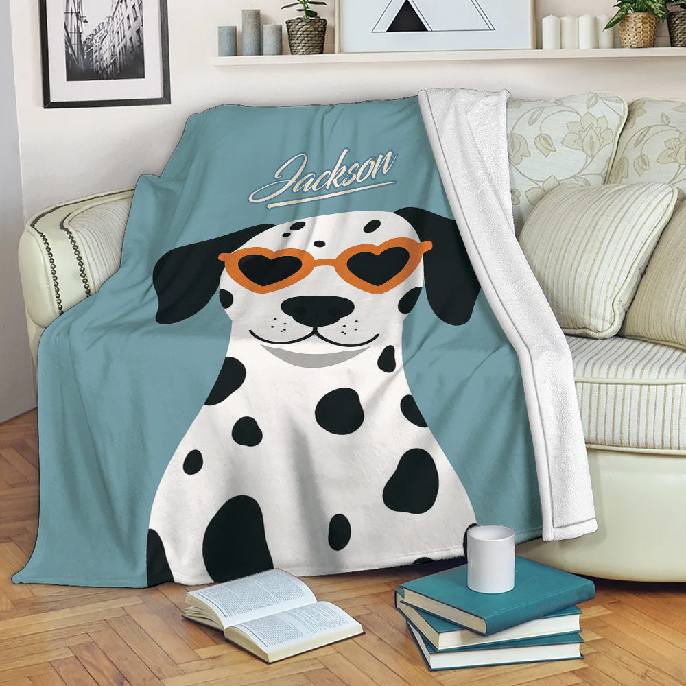 Dalmatian throw blanket displayed on a sofa with a playful spotted dog design
