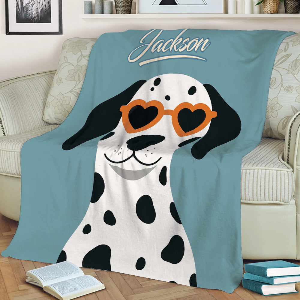 Close view of a Dalmatian blanket with heart-shaped sunglasses in a cozy living room