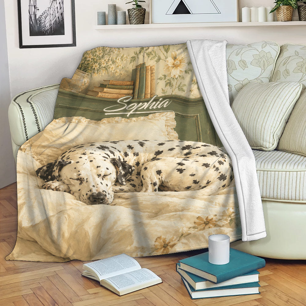 Dalmatian throw blanket draped over a sofa with vintage floral bedroom artwork