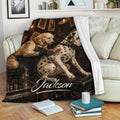 Dalmatian and golden retriever artwork blanket displayed on a couch with a tattoo studio theme