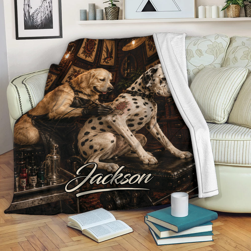 Dalmatian and golden retriever artwork blanket displayed on a couch with a tattoo studio theme