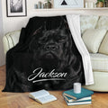 Black Cane Corso throw blanket draped over a sofa in a cozy living room setting