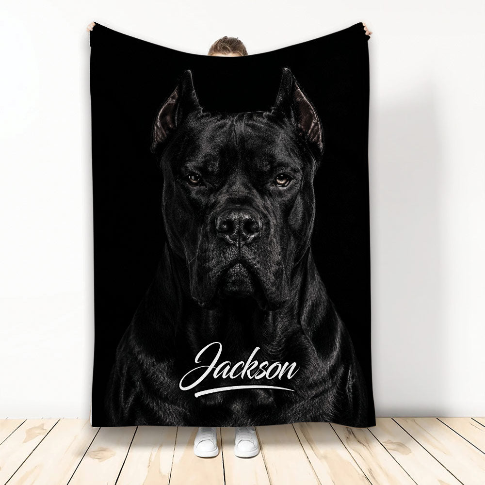 Black Cane Corso portrait blanket displayed vertically against a wall with a bold monochrome dog design