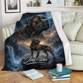 Cane Corso throw blanket displayed on a sofa with mountain scenery, waterfall, moon, and a second dog