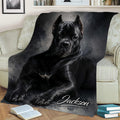 Close view of a black Cane Corso blanket draped over a sofa